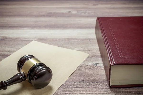 Judge gavel and book on the brown wooden table, justice — Stock Photo, Image