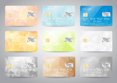 Renkli soyut tasarım arka planına sahip kredi kartları ayarlandı. Kredi kartı, banka kartı, ATM kartı modellemesi ve altın metal gradyan çip çizimi tasarımı için gerçekçi ayrıntılı şablon tasarımı