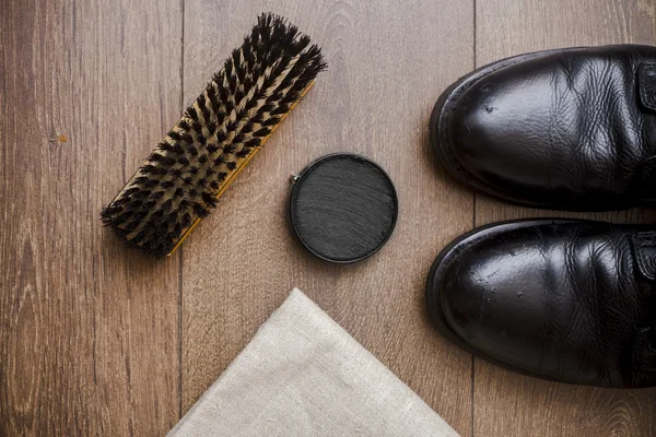 Black leather shoes on a wooden floor Royalty Free Stock Images