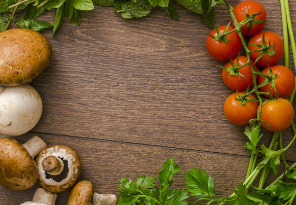 various vegetables in a circle on the wooden floor