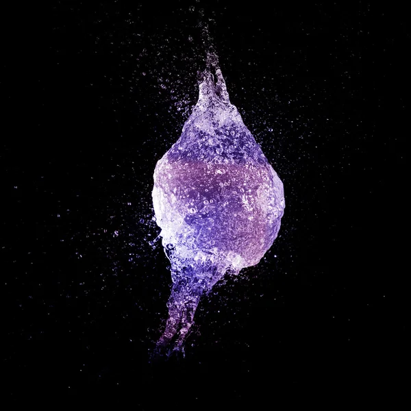 Pink and purple water balloon splash Royalty Free Stock Photos