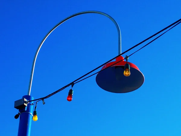 Streetlight with colored bulbs — Stock Photo, Image