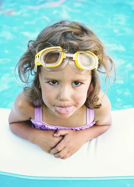 Girl in a blow up pool — Stock Photo, Image