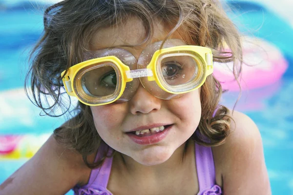 Girl in a blow up pool — Stock Photo, Image