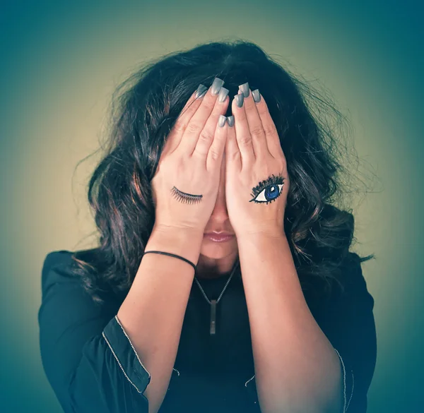 Woman covering her face — Stock Photo, Image