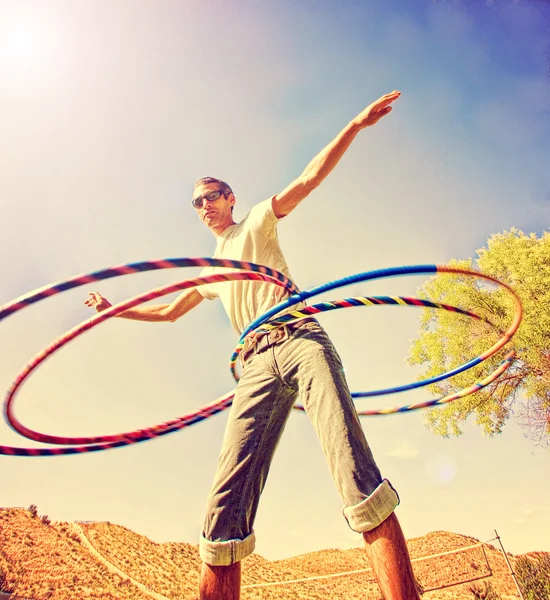 Young man hula hooping — Stock Photo, Image
