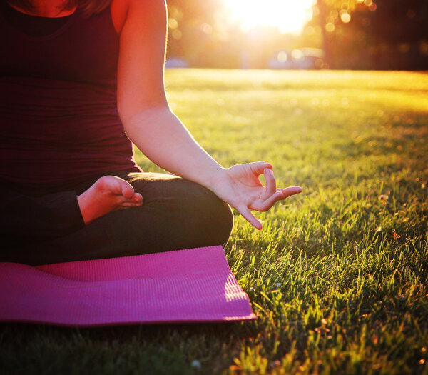 Woman meditating in yoga pose