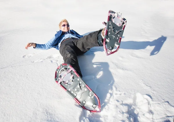 Woman playing in the snow