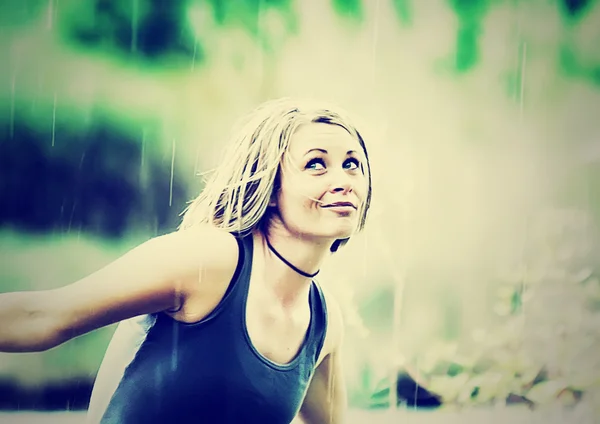 Girl caught in rain shower — Stock Photo, Image