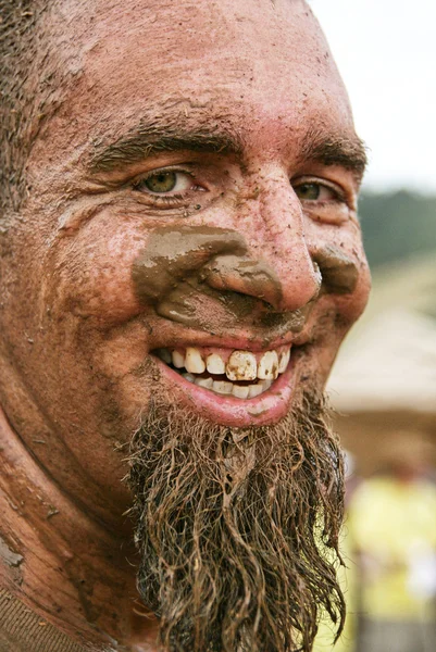 Man with muddy face — Stock Photo, Image