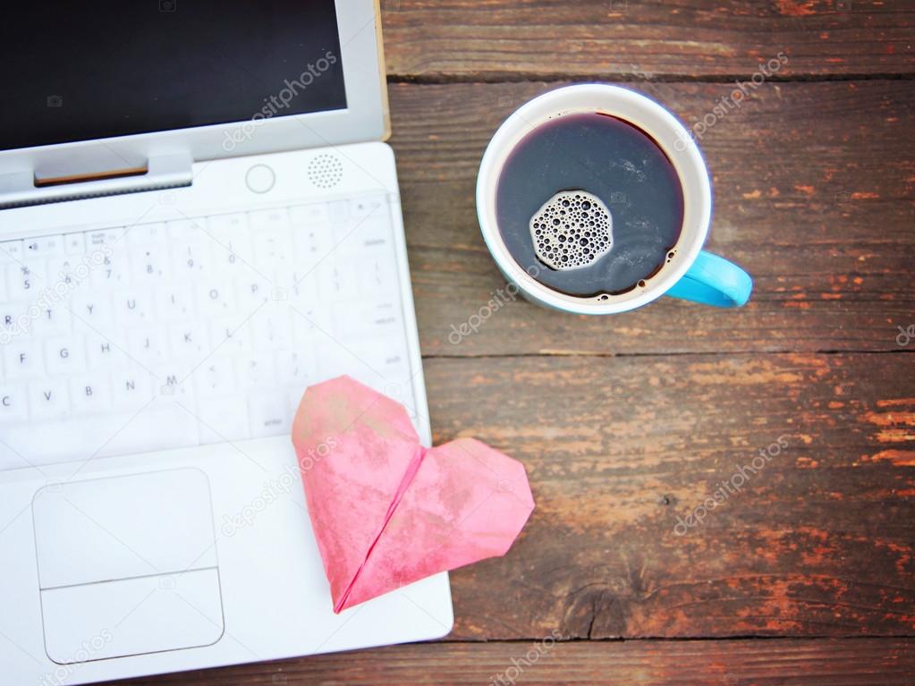 Notebook with cup of coffee