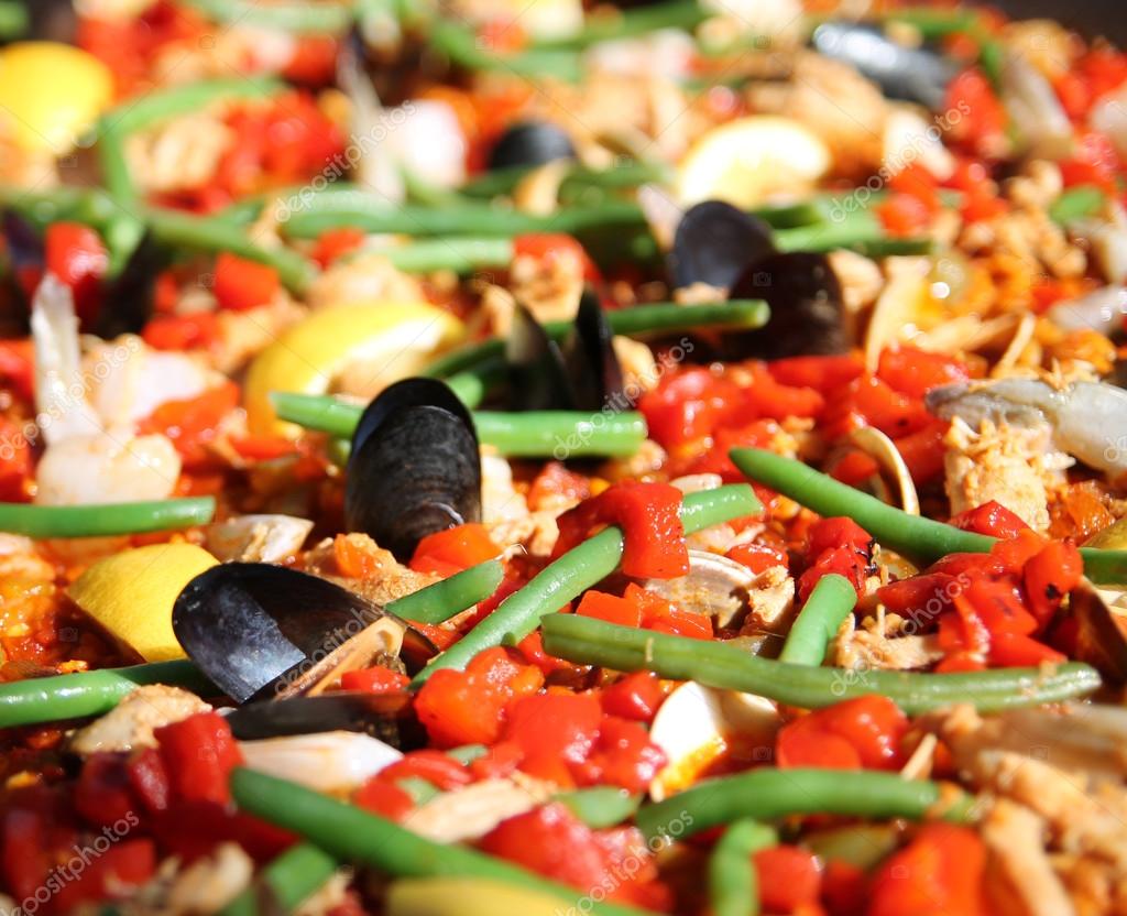 Seafood paella cooking in a pot — Stock Photo © graphicphoto 53624749