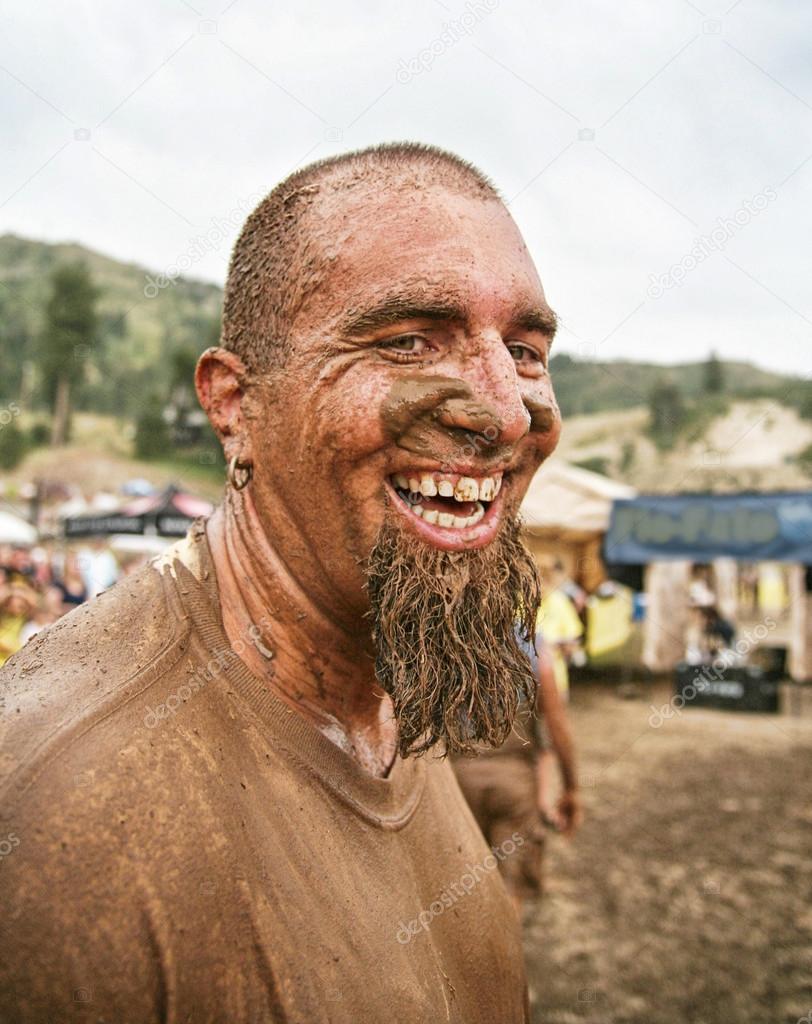Man with muddy face