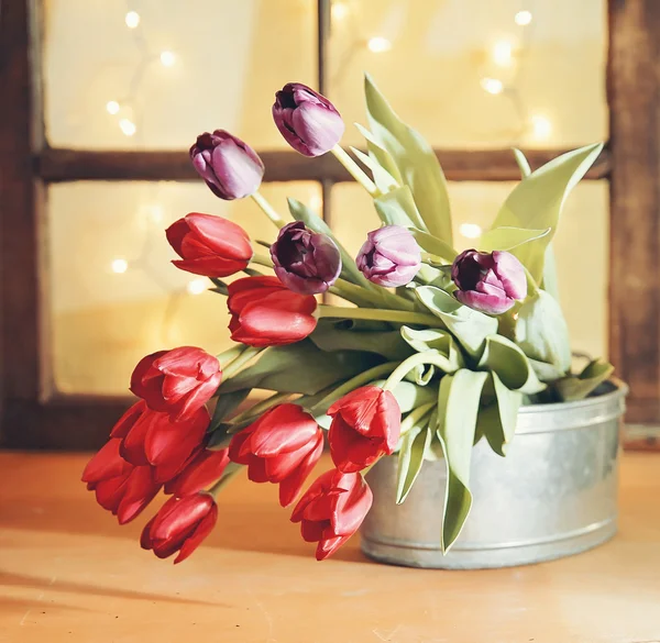 Tulips on a wooden board — Stock Photo, Image