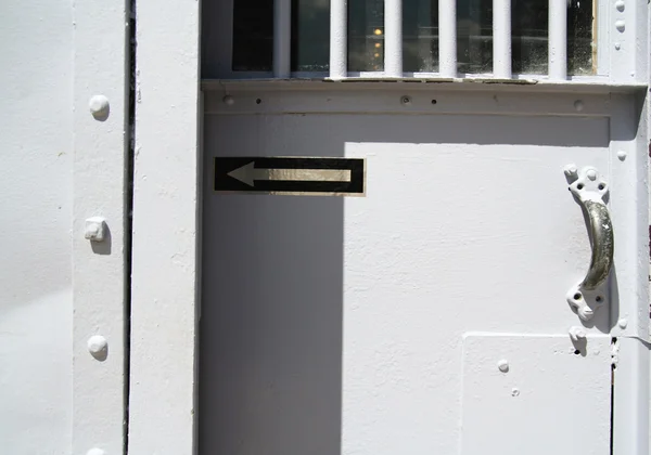 Metal door in prison yard — Stock Photo, Image