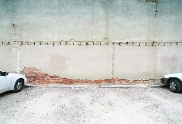 Modern cars near old brick wall — Stock Photo, Image