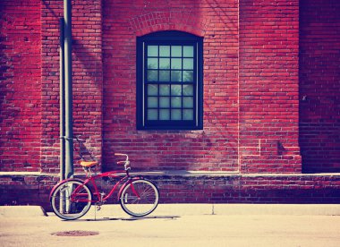 Bike in front of brick wall clipart
