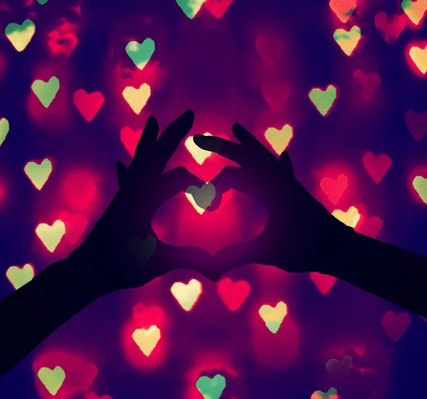 Two hands making a heart shape in the sky — Stock Photo, Image