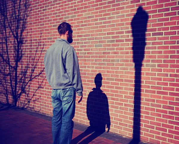 Man looking at his shadow — Stock Photo, Image