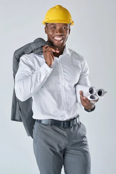 Black architect holding plans — Stock Photo, Image