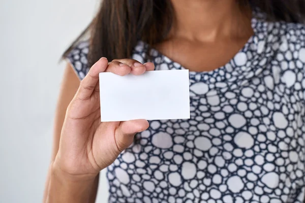 woman holding empty white card