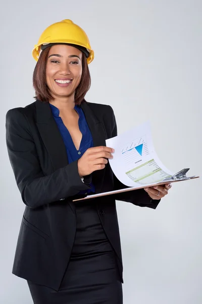Woman engineer architect holding clipboard — Stock fotografie