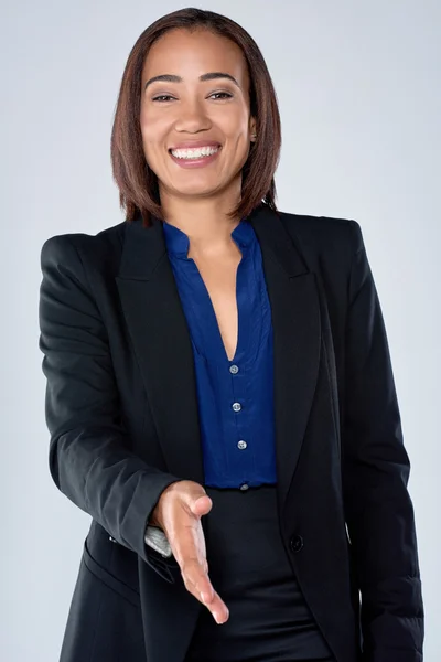 Business woman extending hand for handshake — Stock Photo, Image