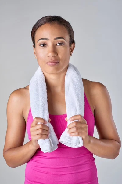 Sporty woman with towel after exercise — Stock Photo, Image