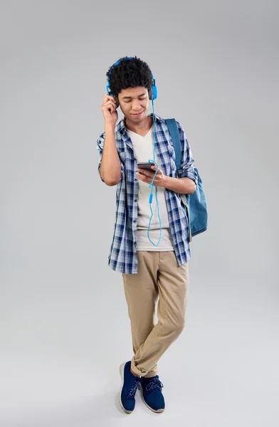 Mixed race student with mobile — Stock Photo, Image