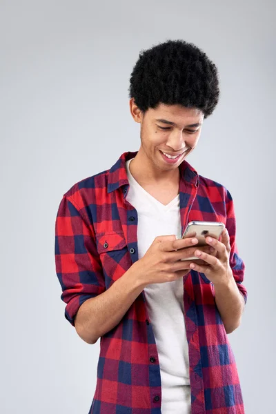 Mixed race student browsing mobile — Stock Photo, Image