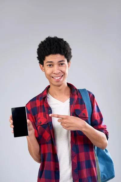 Studente di razza mista con cellulare — Foto Stock