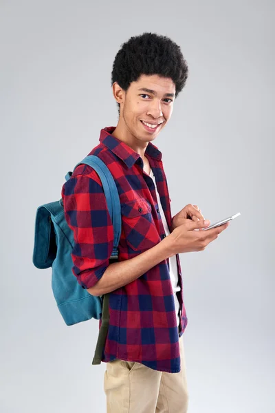 Mixed race student browsing mobile — Stock Photo, Image