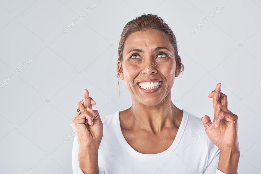Woman with fingers crossed Stock Photo by ©Daxiao_Productions 119861150