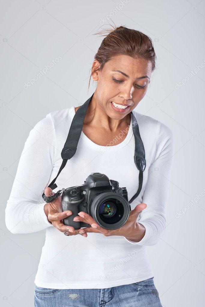 mixed race woman with dslr camera