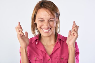 woman with fingers crossed clipart