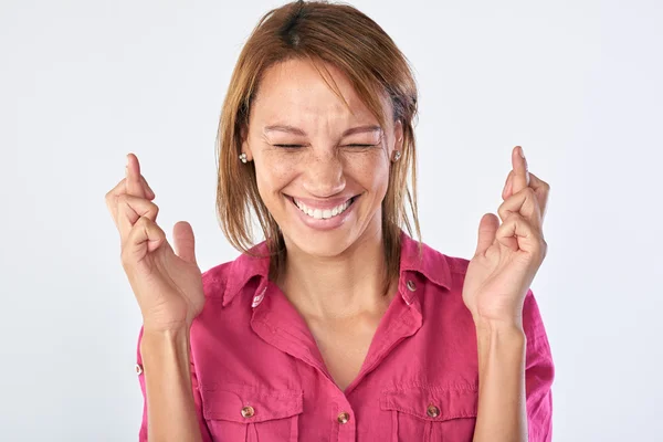 Woman with fingers crossed — Stock Photo, Image