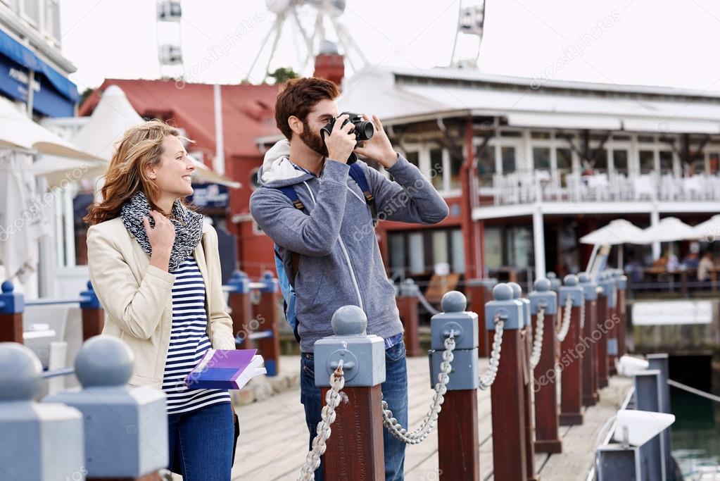 couple taking pictures on holiday