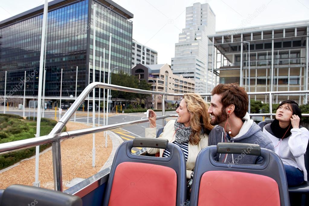 Couple on open top tourist bus