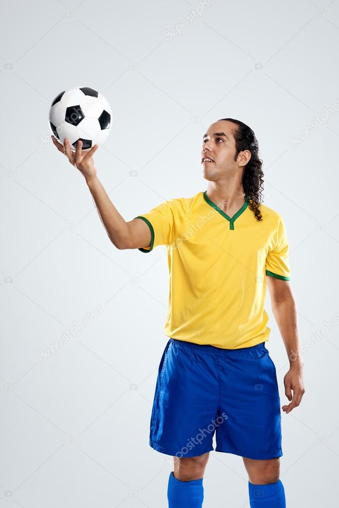 Football player spinning ball on finger