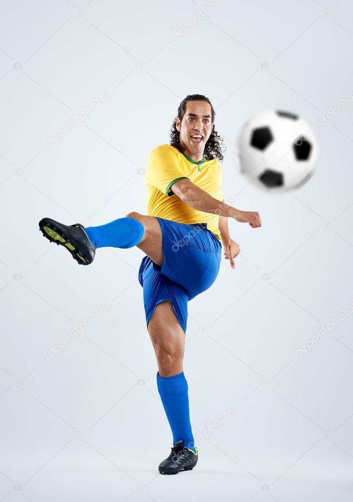 Football player shoots for goal