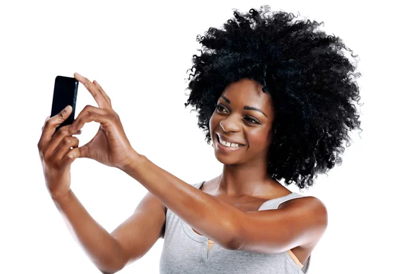 African woman with afro taking picture — Stock Photo, Image