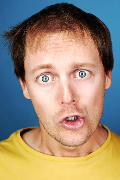 Man pulling silly expression — Stock Photo, Image