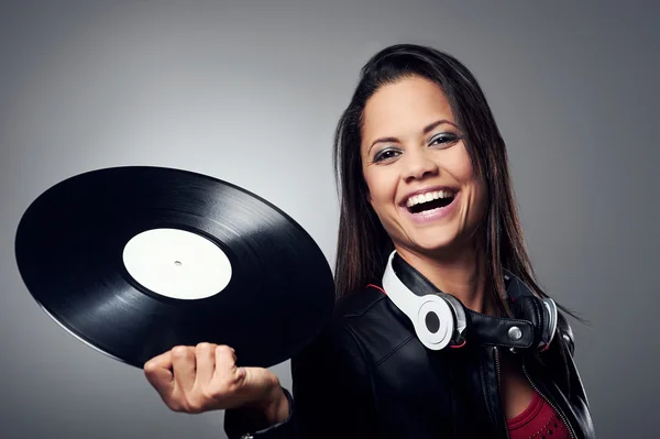 Woman dj with vinyl record and headphones