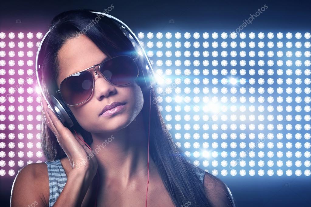 woman dj enjoying music on headphones