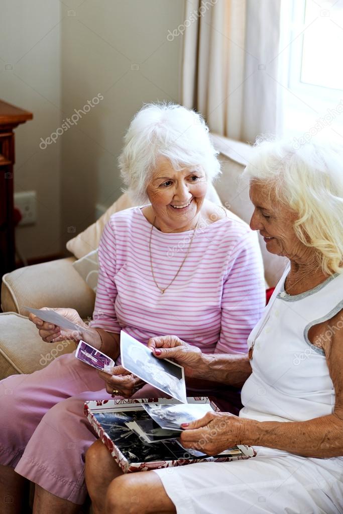 old friends looking at photographs