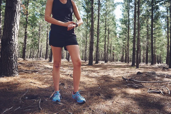 Woman checking on gps sports watch