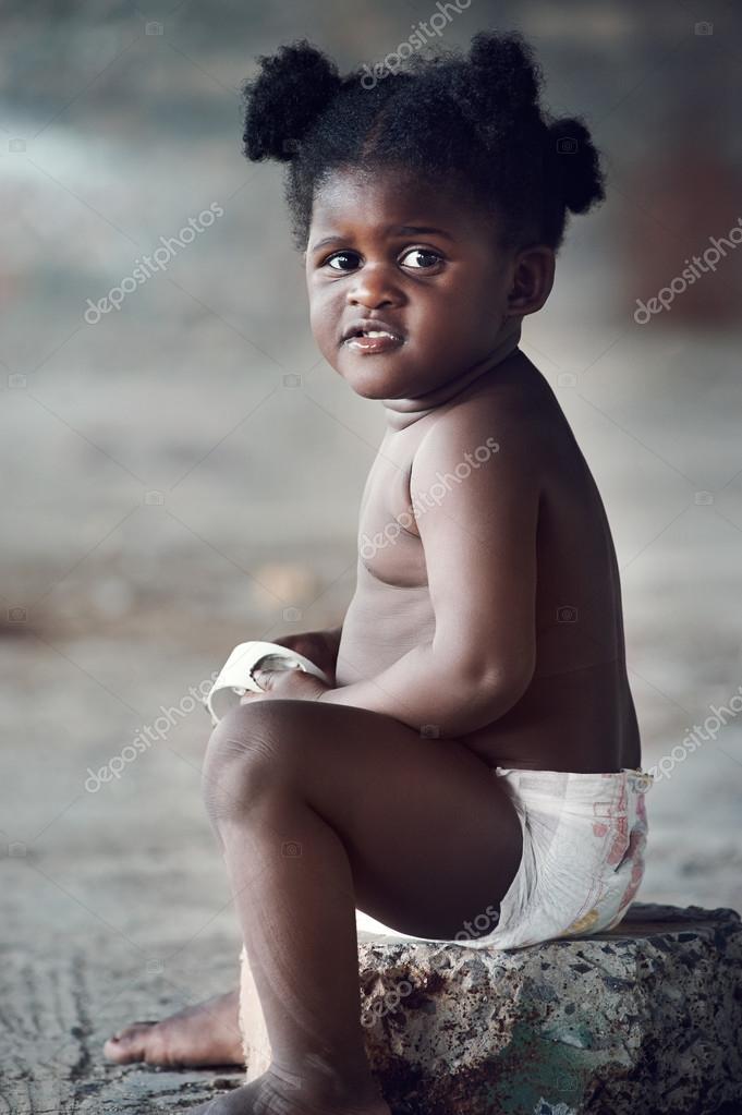 African baby playing with trash Stock Photo by ©Daxiao_Productions 74980979