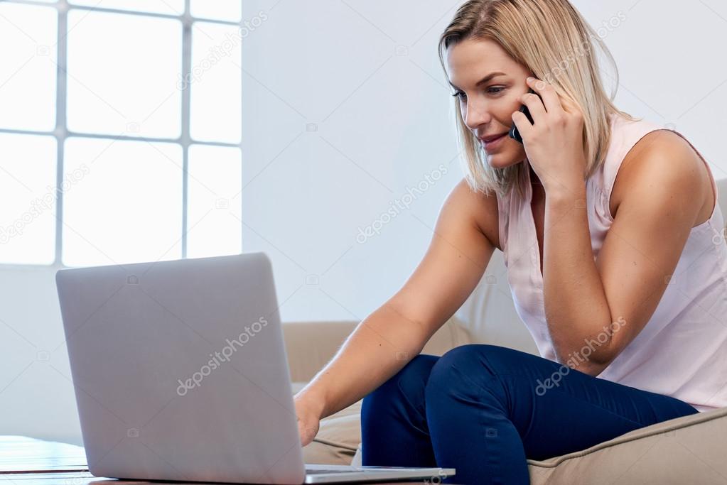Woman on sofa shopping online