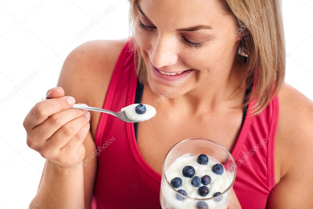 Woman enjoying eating yogurt
