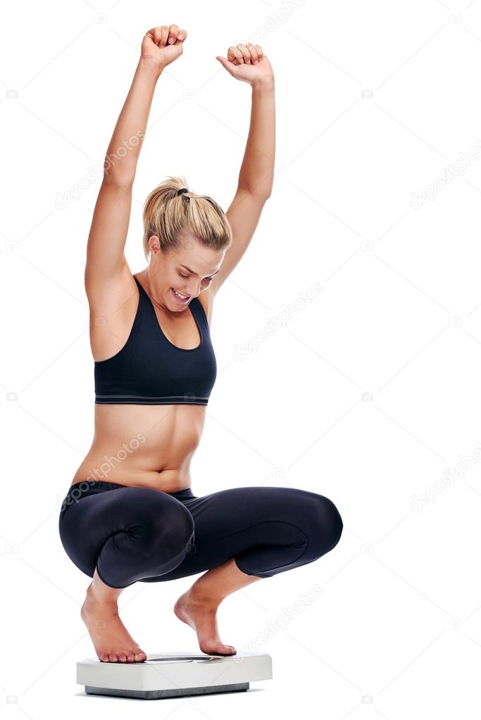 Woman on scale cheering